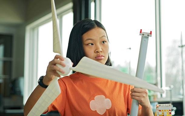 a preteen girl making windmill stem activity